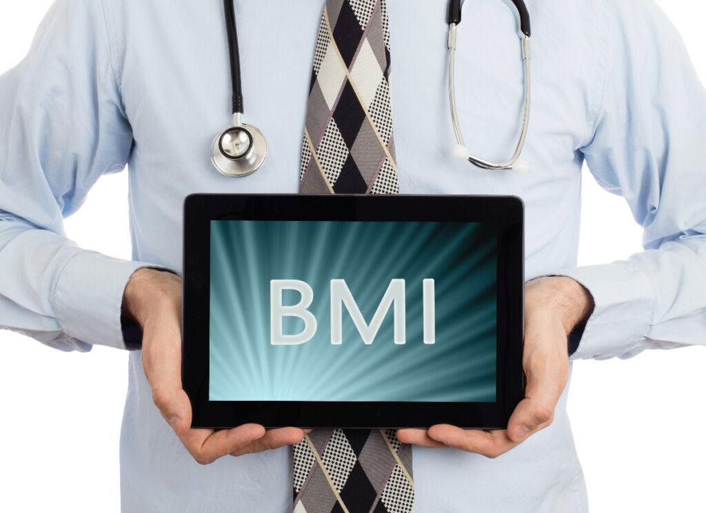 Doctor holding tablet that says BMI to illustrate BMI for Gastric Bypass